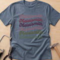 Boho Script Metalsmith jewelry maker t-shirt in Dark Heather, flat lay with jeweler's tools