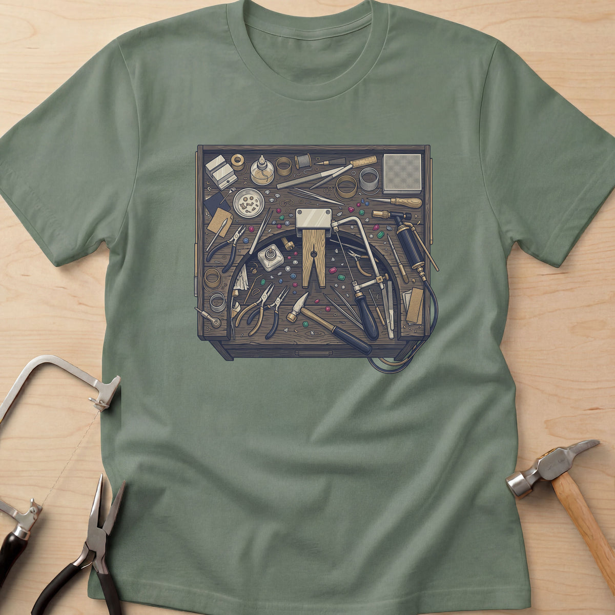 Jeweler's Bench jewelry maker t-shirt in Military Green, flat lay with jeweler's tools