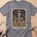 The Jeweler Tarot (Daisies) jewelry maker t-shirt in Charcoal, flat lay with jeweler's tools