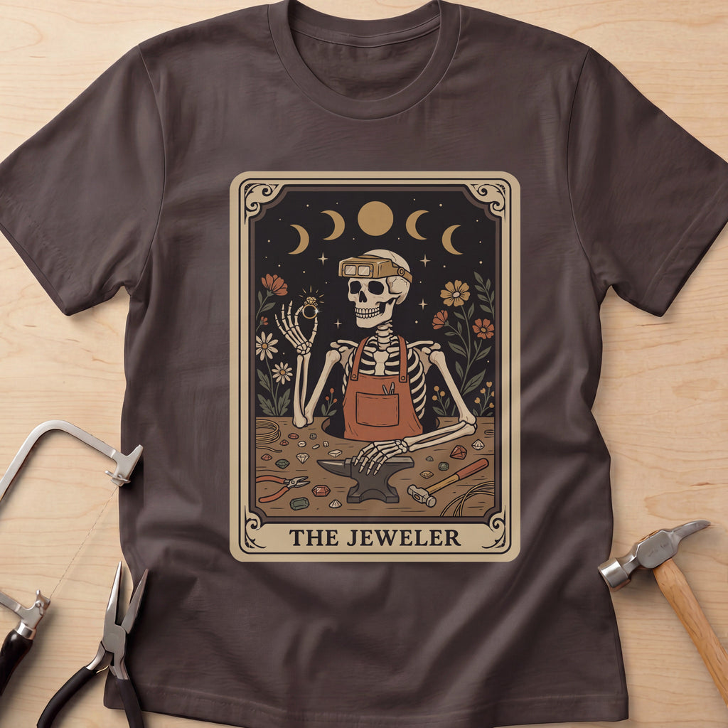 The Jeweler Tarot (Daisies) jewelry maker t-shirt in Dark Chocolate, flat lay with jeweler's tools