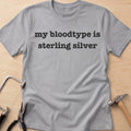 Blood Type: Sterling Silver silversmith t-shirt in Sport Grey, flat lay with jeweler's tools